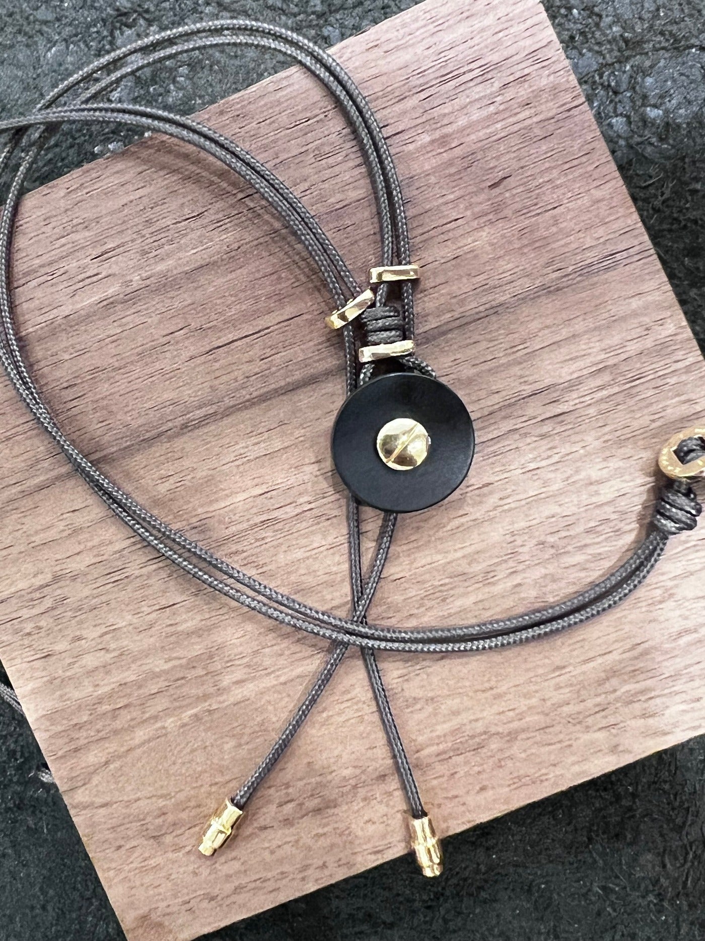 Ines: Hand-Carved Buffalo Horn Necklace with 18kt Yellow Gold Screw